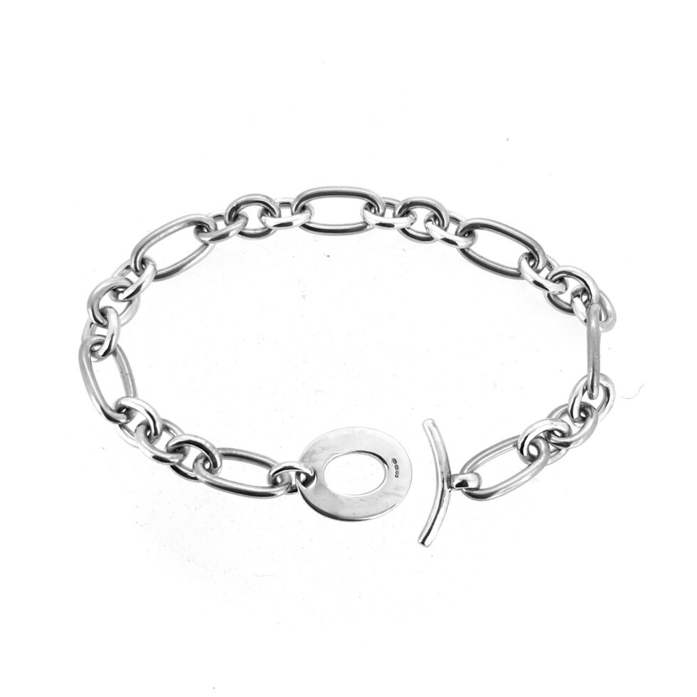 Vintage silver charm bracelet with curved T bar fastening