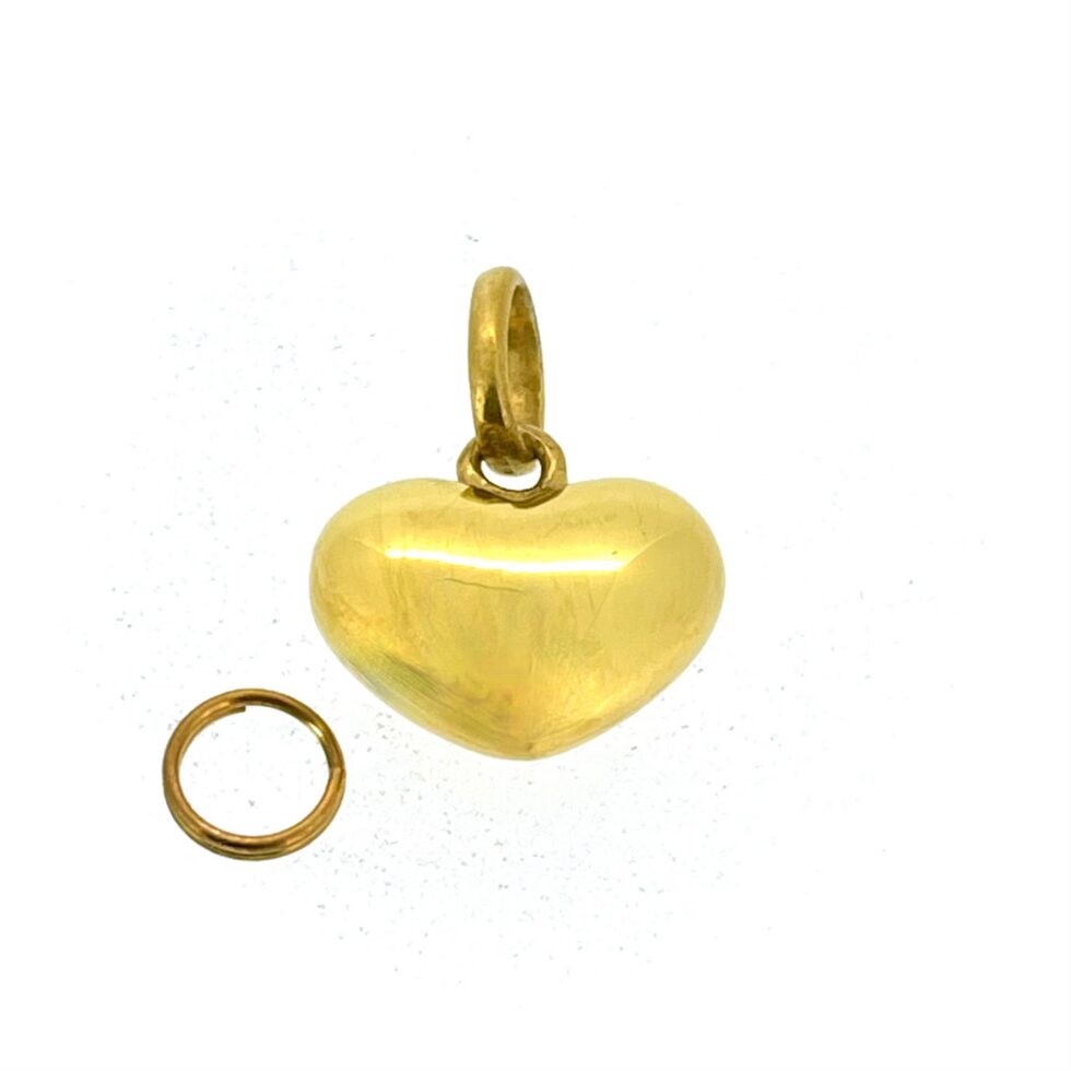 Side view of vintage Puffed Heart Charm showing 7mm thickness