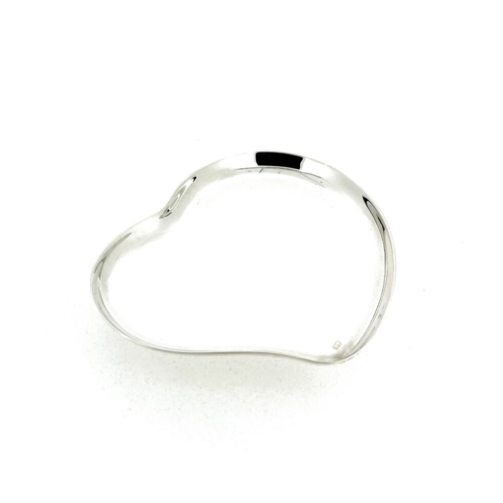 Vintage Links of London heart dish showing polished silver surface