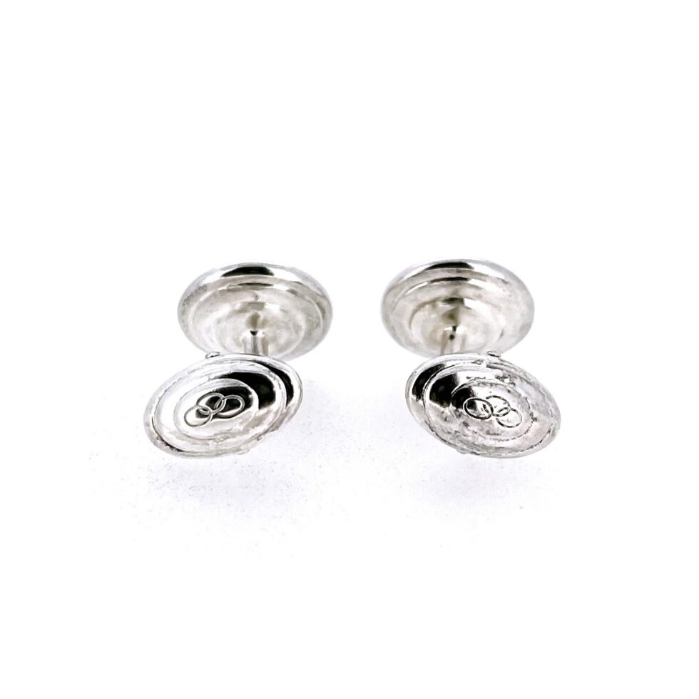 Side view of Links of London mother of pearl swivel cufflinks