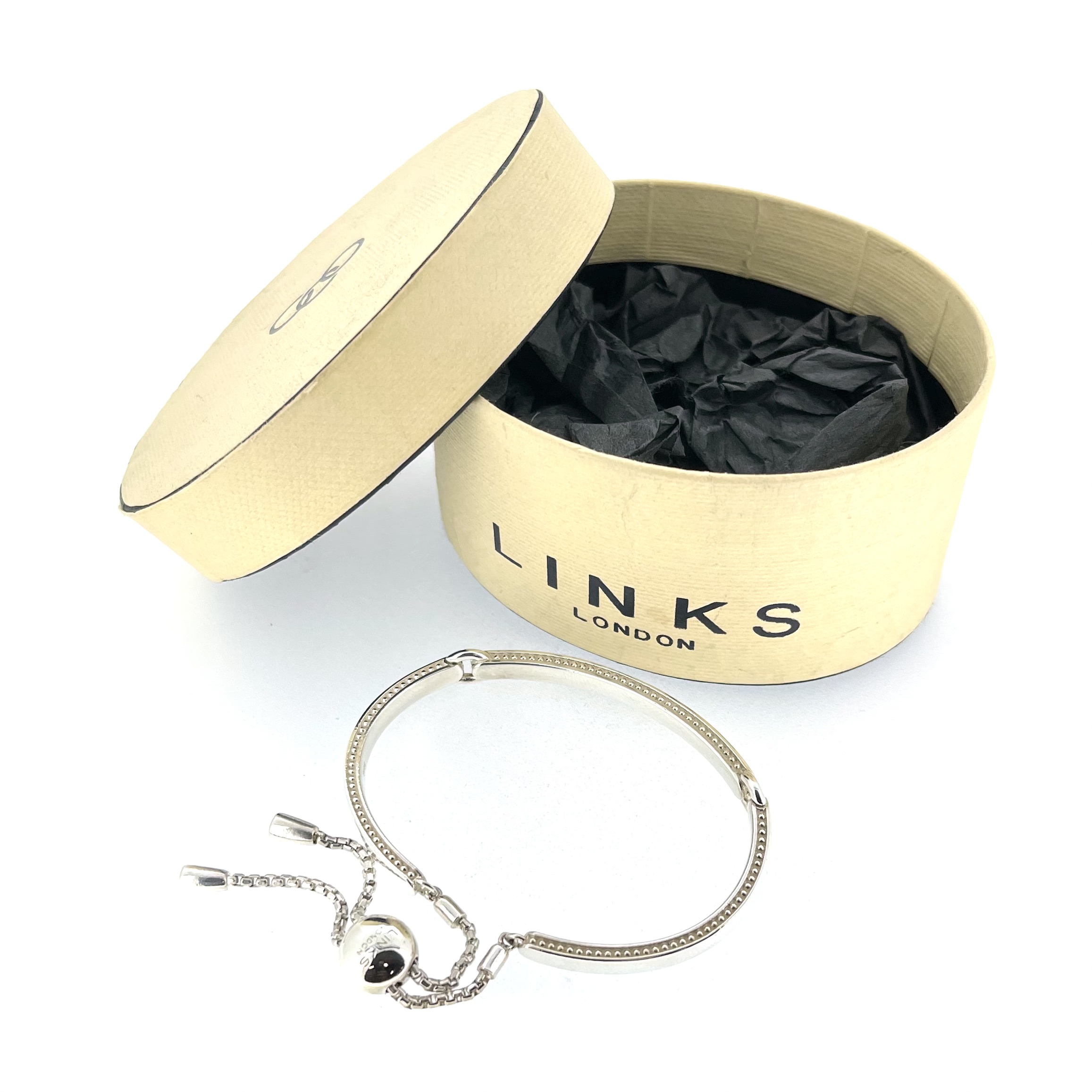 Narrative Bracelet showing adjustable tassel chains
