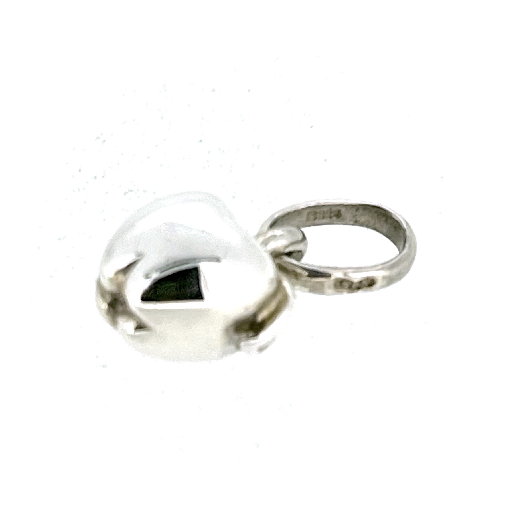 Side view of vintage sterling silver apple charm
