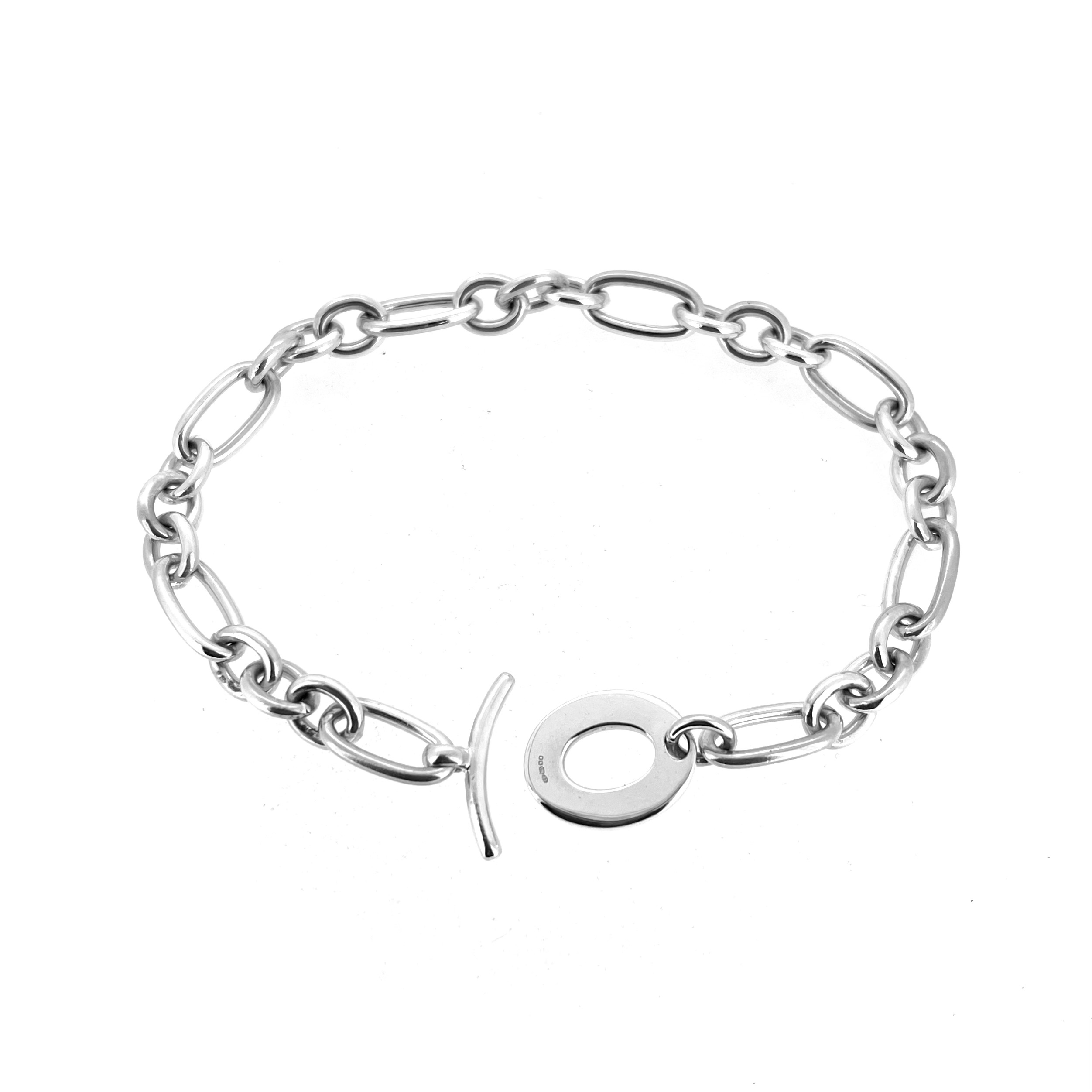 Vintage silver charm bracelet with curved T bar