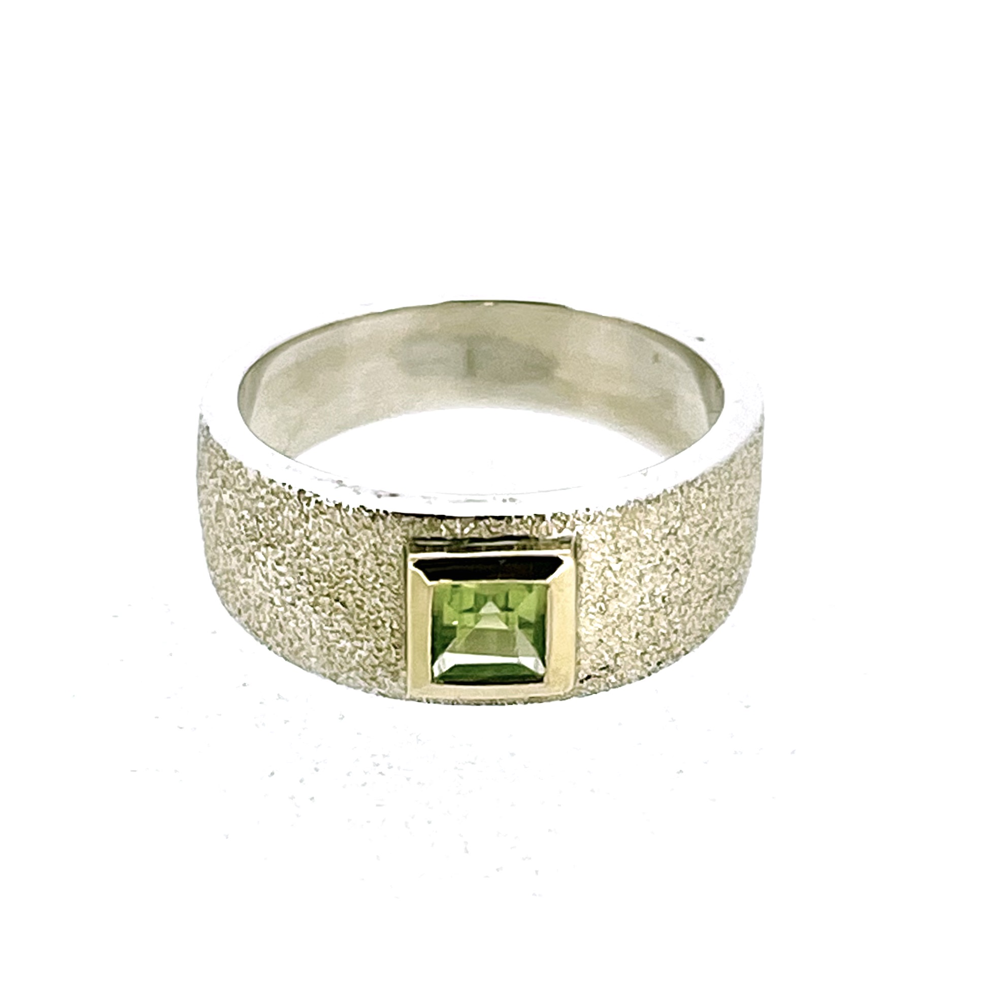 Vintage peridot ring with champagne-toned sterling silver band