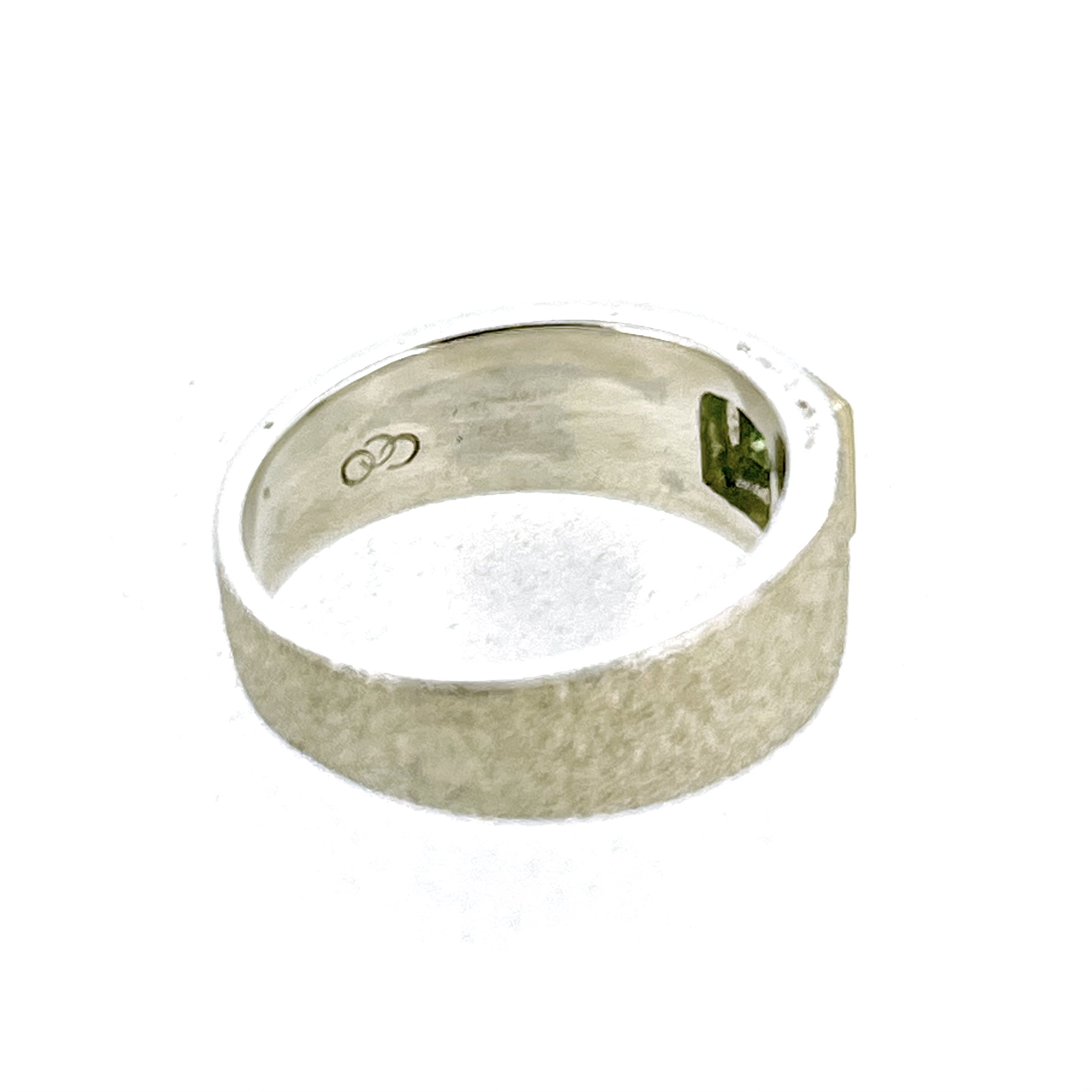 Square green peridot set into vintage sterling silver ring