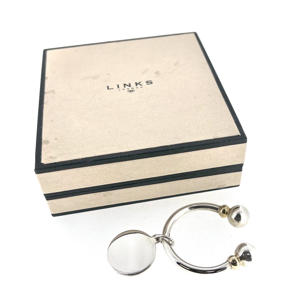 Round Tag Screwball Keyring in polished sterling silver