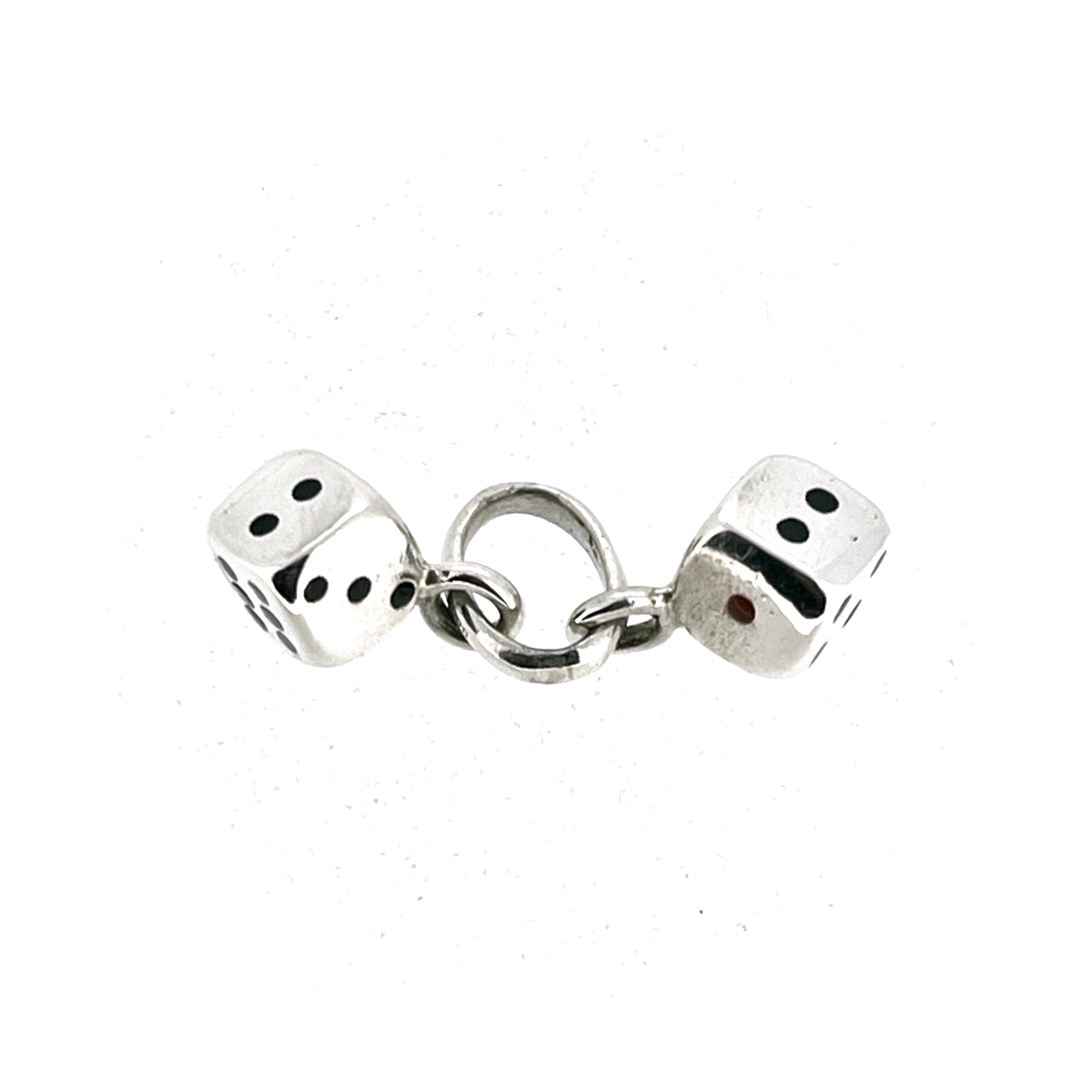 Pair of miniature silver dice with black enamel pips
