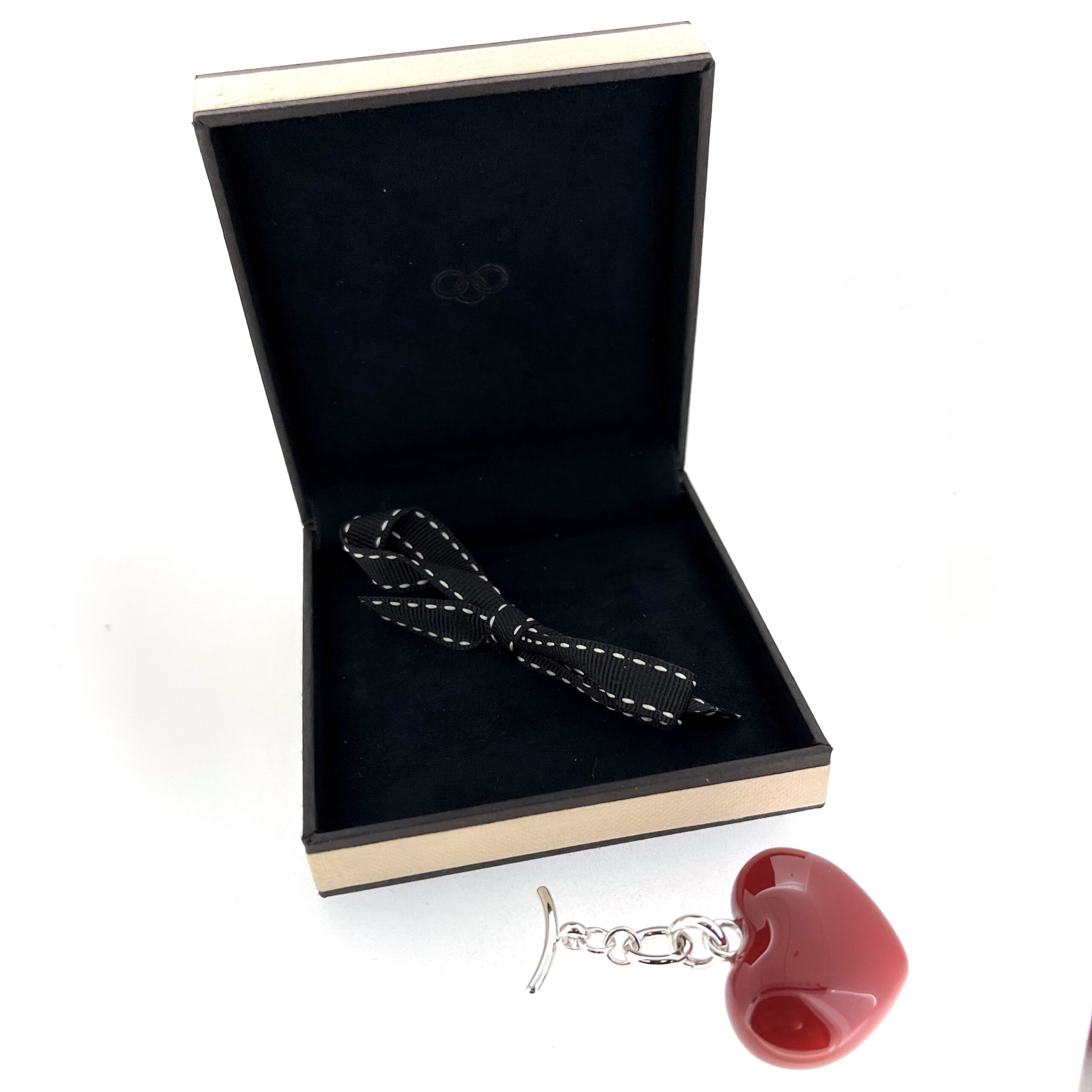 Red enamel heart measuring 35mm wide on silver-plated chain