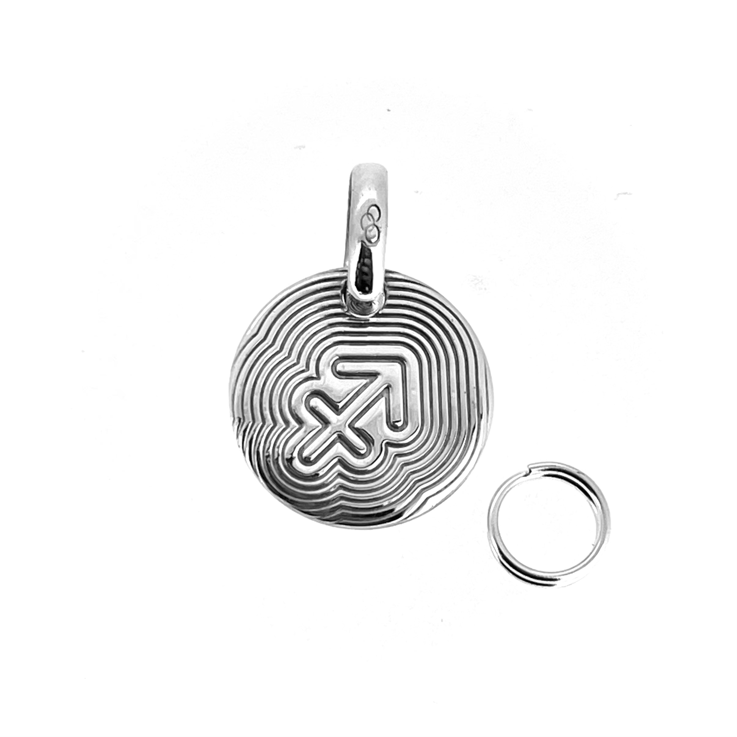 Sterling silver Sagittarius disc with concentric line design