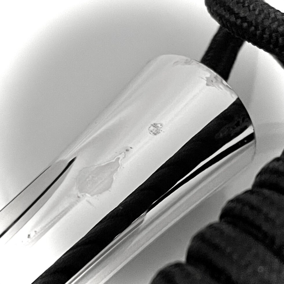 Silver plated handles showing age-related surface discolouration